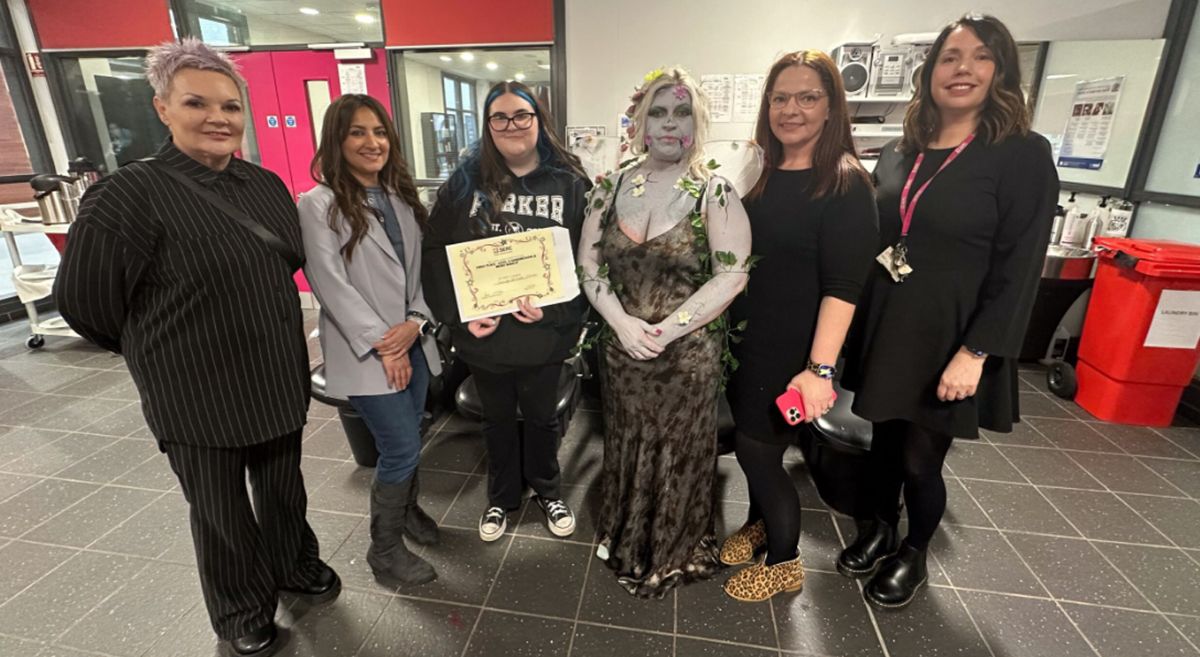 Picture of Hair and Media competition winner with judges and tutor